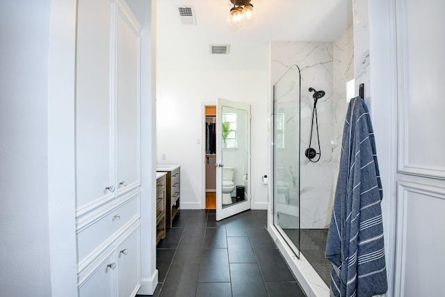 22035 Buescher Rd, Tomball, TX 77377 - full bath featuring a marble finish shower, toilet, vanity, and tile patterned flooring