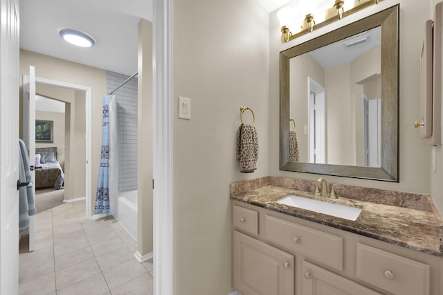 7 Newland Ct, The Woodlands, TX 77382 - full bath with vanity, tile patterned floors, shower / bath combination with curtain, and baseboards