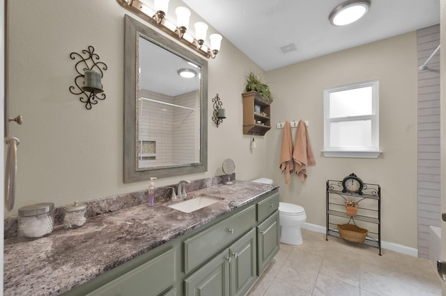 7 Newland Ct, The Woodlands, TX 77382 - bathroom featuring vanity, toilet, tile patterned flooring, and baseboards