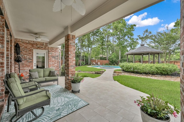 7 Newland Ct, The Woodlands, TX 77382 - view of patio featuring a ceiling fan, a gazebo, and an outdoor hangout area