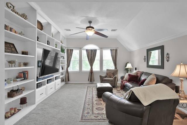 7 Newland Ct, The Woodlands, TX 77382 - living room with healthy amount of natural light, a ceiling fan, light colored carpet, ornamental molding, and vaulted ceiling