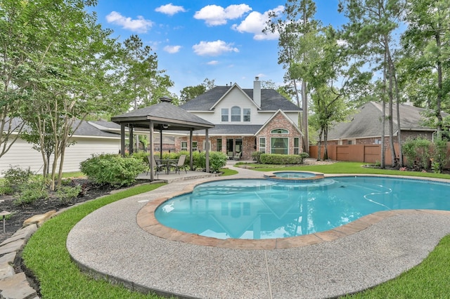 7 Newland Ct, The Woodlands, TX 77382 - view of swimming pool with a gazebo, a patio area, and a pool with connected hot tub
