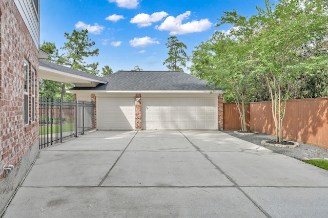 7 Newland Ct, The Woodlands, TX 77382 - garage featuring concrete driveway