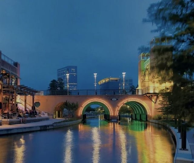 7 Newland Ct, The Woodlands, TX 77382 - view of pool at twilight