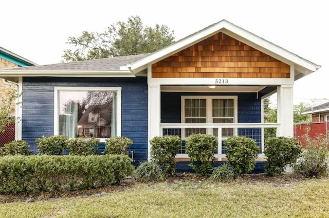 5213 Claremont St, Houston, TX 77023 - view of front of house featuring a porch and a front yard