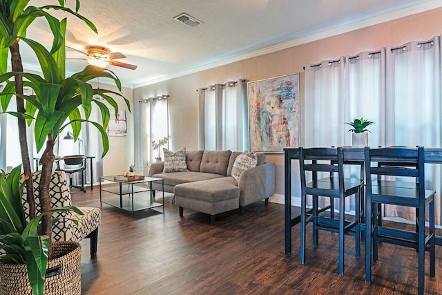 5213 Claremont St, Houston, TX 77023 - living room featuring a ceiling fan, dark wood-style floors, and ornamental molding