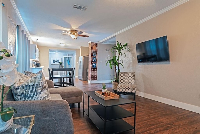 5213 Claremont St, Houston, TX 77023 - living area featuring wood finished floors, a ceiling fan, baseboards, crown molding, and a textured wall