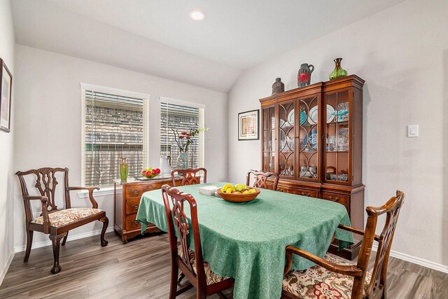 9521 Mountain Maple Pl, Conroe, TX 77385 - dining room with wood finished floors, baseboards, lofted ceiling, and recessed lighting