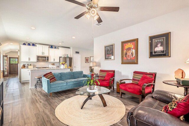 9521 Mountain Maple Pl, Conroe, TX 77385 - living room with lofted ceiling, wood finished floors, a ceiling fan, recessed lighting, and baseboards