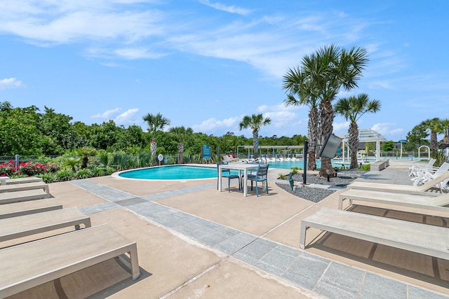 9521 Mountain Maple Pl, Conroe, TX 77385 - community pool with a patio