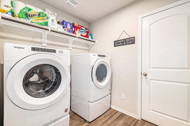 9521 Mountain Maple Pl, Conroe, TX 77385 - laundry area featuring washer and dryer, light wood-type flooring, and baseboards