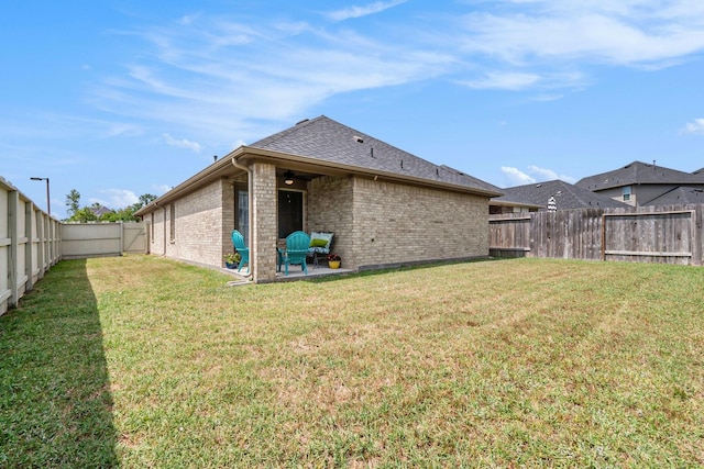 9521 Mountain Maple Pl, Conroe, TX 77385 - rear view of property featuring brick siding, a patio, and roof with shingles