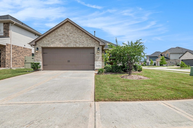 9521 Mountain Maple Pl, Conroe, TX 77385 - view of front of house featuring a front yard, driveway, and an attached garage