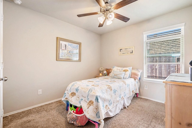 9521 Mountain Maple Pl, Conroe, TX 77385 - carpeted bedroom with baseboards and ceiling fan