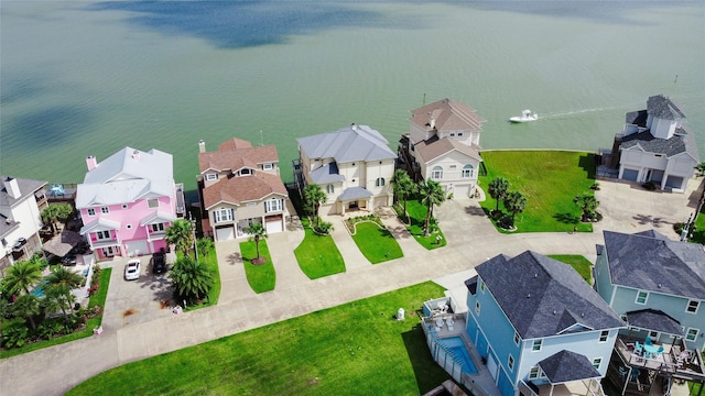 1554 Windsong Way, Tiki Island, TX 77554 - aerial perspective of suburban area featuring a nearby body of water