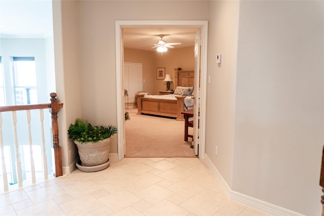 1554 Windsong Way, Tiki Island, TX 77554 - hallway featuring light colored carpet and baseboards
