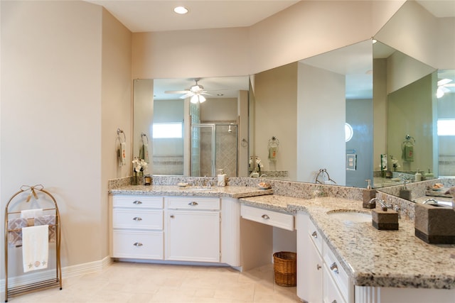 1554 Windsong Way, Tiki Island, TX 77554 - bathroom with a ceiling fan, double vanity, a stall shower, and tile patterned floors