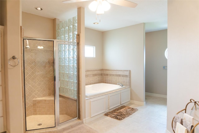 1554 Windsong Way, Tiki Island, TX 77554 - bathroom with a bath, a ceiling fan, a shower stall, and tile patterned flooring