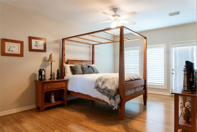 1554 Windsong Way, Tiki Island, TX 77554 - bedroom featuring light wood finished floors and baseboards