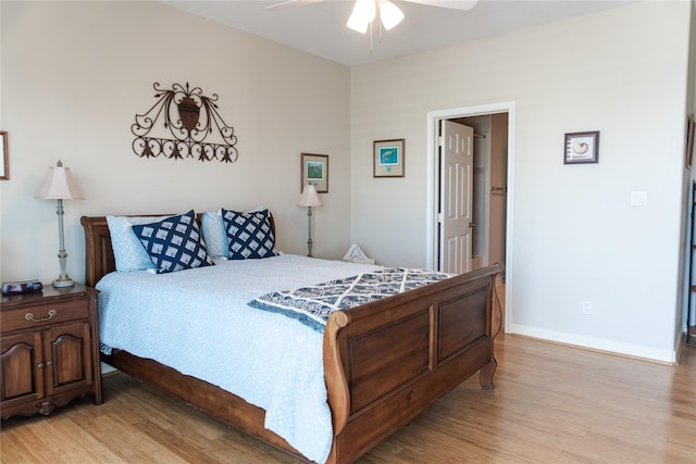 1554 Windsong Way, Tiki Island, TX 77554 - bedroom featuring light wood finished floors, baseboards, and a ceiling fan