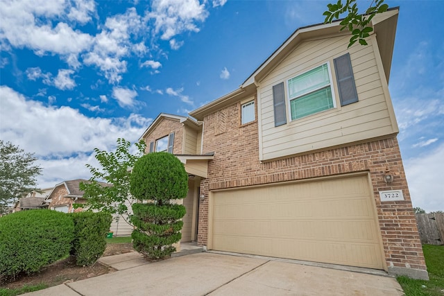 3722 Glover Meadows Ln, Houston, TX 77047 - view of front of home featuring brick siding, an attached garage, and concrete driveway