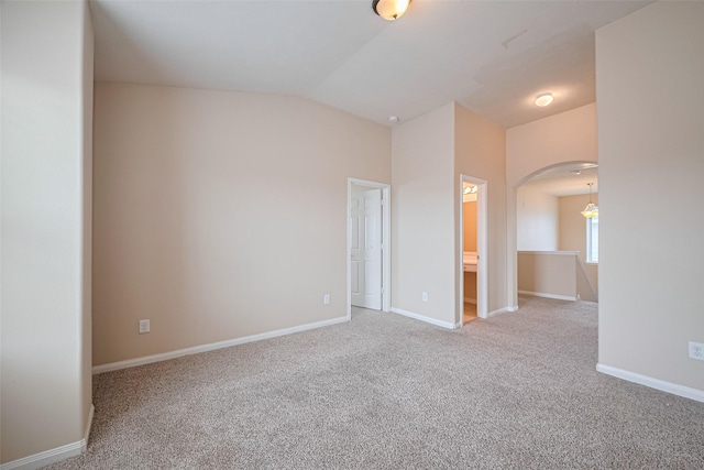 3722 Glover Meadows Ln, Houston, TX 77047 - carpeted empty room featuring arched walkways, lofted ceiling, and baseboards