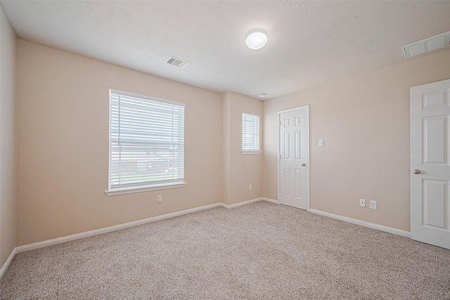 3722 Glover Meadows Ln, Houston, TX 77047 - empty room featuring light colored carpet and baseboards