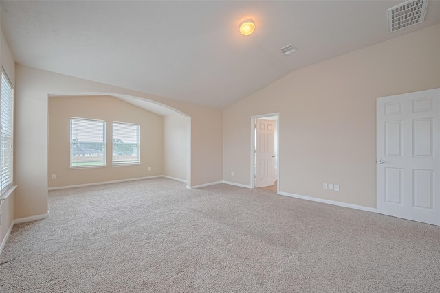 3722 Glover Meadows Ln, Houston, TX 77047 - unfurnished room with vaulted ceiling, light carpet, baseboards, and arched walkways