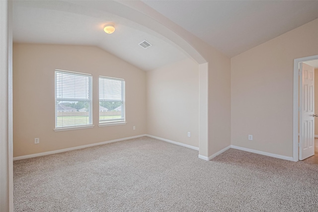 3722 Glover Meadows Ln, Houston, TX 77047 - additional living space featuring vaulted ceiling, arched walkways, carpet floors, and baseboards