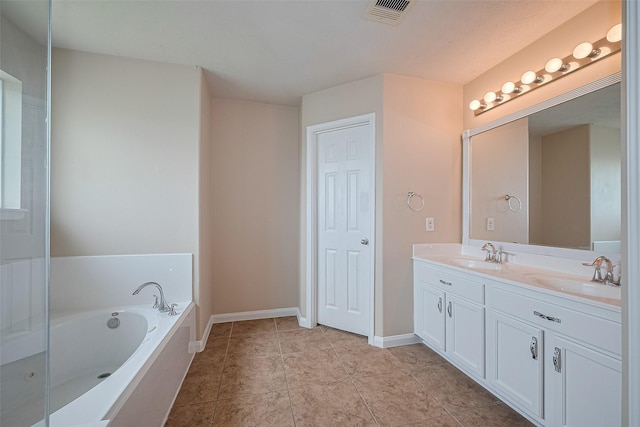 3722 Glover Meadows Ln, Houston, TX 77047 - full bath featuring double vanity, a garden tub, baseboards, and tile patterned flooring