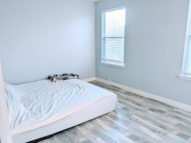 6318 Alpine Trail Ln, Katy, TX 77494 - bedroom with wood finished floors and baseboards