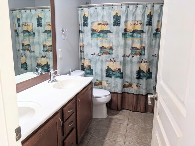 6318 Alpine Trail Ln, Katy, TX 77494 - full bath featuring toilet, double vanity, tile patterned flooring, and curtained shower