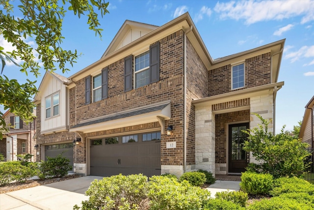 12 Centennial Ridge Pl, Magnolia, TX 77354 - view of property featuring an attached garage, board and batten siding, driveway, and brick siding