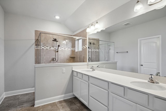 12 Centennial Ridge Pl, Magnolia, TX 77354 - bathroom featuring double vanity, a tile shower, lofted ceiling, and baseboards