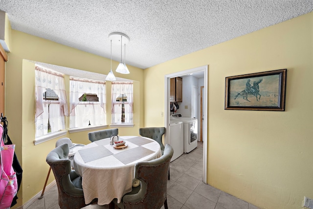 19527 Enchanted Spring Dr, Spring, TX 77388 - dining space with washer and clothes dryer, light tile patterned floors, and a textured ceiling
