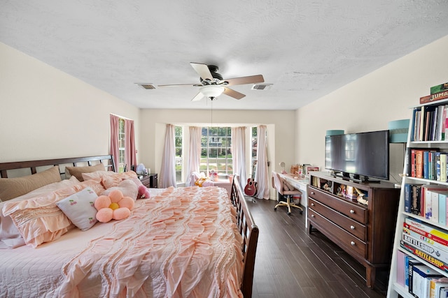 19527 Enchanted Spring Dr, Spring, TX 77388 - bedroom with dark wood-type flooring, a textured ceiling, and ceiling fan