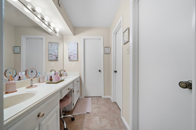 19527 Enchanted Spring Dr, Spring, TX 77388 - full bath featuring double vanity, tile patterned flooring, and baseboards