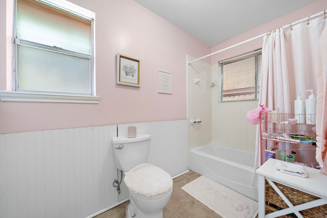19527 Enchanted Spring Dr, Spring, TX 77388 - full bathroom featuring toilet, shower / bath combo, tile patterned flooring, and a wainscoted wall
