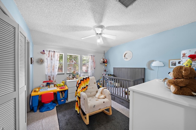 19527 Enchanted Spring Dr, Spring, TX 77388 - carpeted bedroom with a closet, a textured ceiling, ceiling fan, and a nursery area