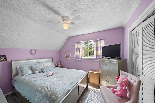 19527 Enchanted Spring Dr, Spring, TX 77388 - bedroom featuring a textured ceiling, a closet, vaulted ceiling, a ceiling fan, and baseboards