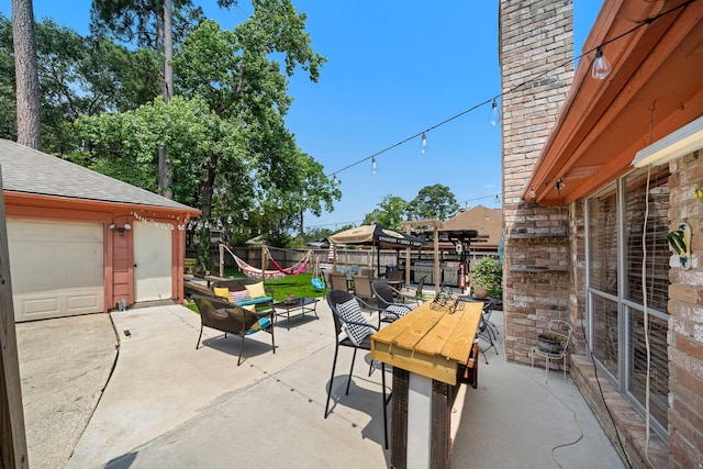 19527 Enchanted Spring Dr, Spring, TX 77388 - view of patio with outdoor dining area and an outdoor structure