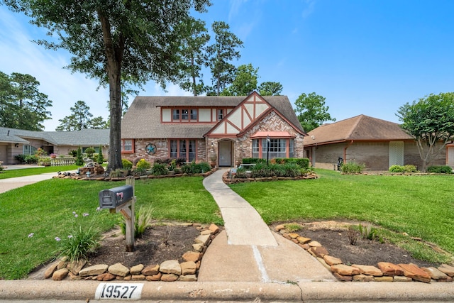 19527 Enchanted Spring Dr, Spring, TX 77388 - tudor house featuring brick siding and a front yard