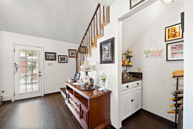 19527 Enchanted Spring Dr, Spring, TX 77388 - entryway with dark wood-type flooring, stairway, baseboards, and vaulted ceiling