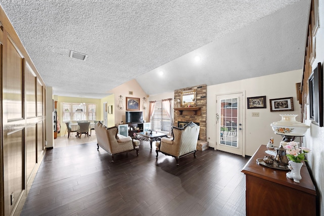 19527 Enchanted Spring Dr, Spring, TX 77388 - living area with a textured ceiling, a large fireplace, plenty of natural light, dark wood-type flooring, and lofted ceiling