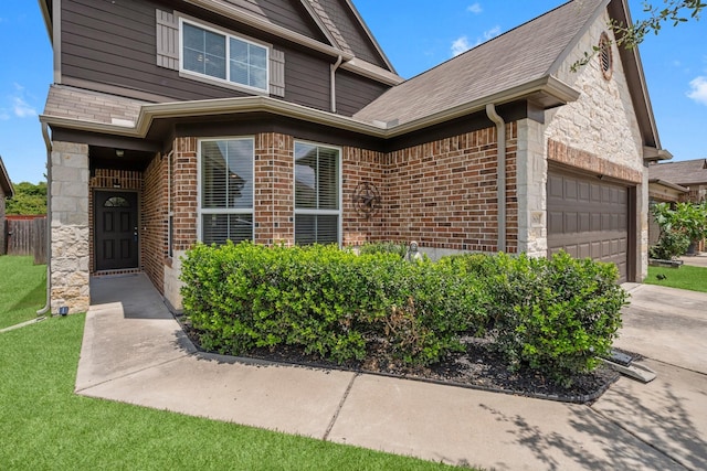 10606 Chestnut Pathway, Tomball, TX 77375 - view of front of home with brick siding, stone siding, a garage, and concrete driveway