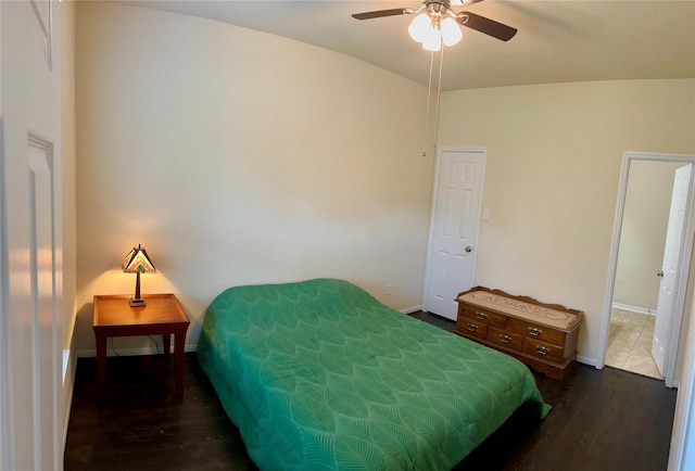 10606 Chestnut Pathway, Tomball, TX 77375 - bedroom with dark wood-style flooring, baseboards, and ceiling fan