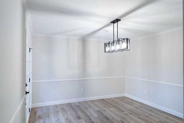 2243 W Alabama St Unit 10, Houston, TX 77098 - spare room with wood finished floors, crown molding, a chandelier, and baseboards