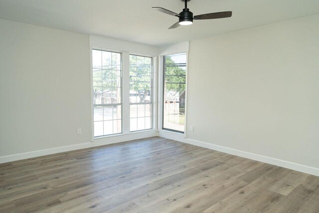 2243 W Alabama St Unit 10, Houston, TX 77098 - unfurnished room featuring healthy amount of natural light, a ceiling fan, and baseboards