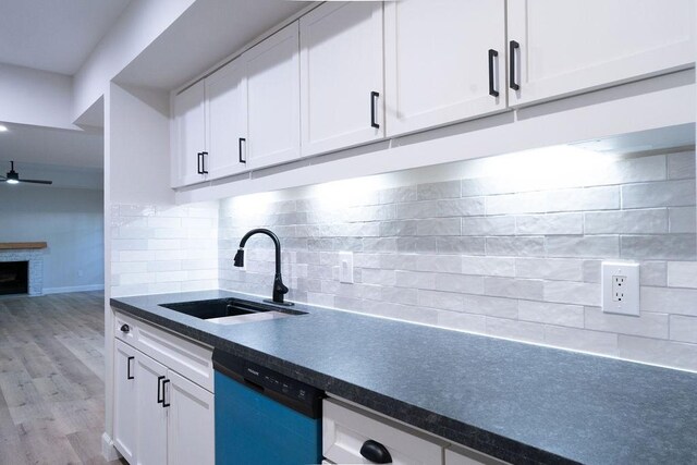 2243 W Alabama St Unit 10, Houston, TX 77098 - kitchen featuring a sink, dishwasher, dark countertops, and decorative backsplash