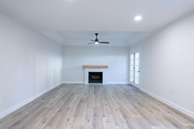 2243 W Alabama St Unit 10, Houston, TX 77098 - unfurnished living room with a ceiling fan, baseboards, light wood-type flooring, a fireplace, and ornamental molding